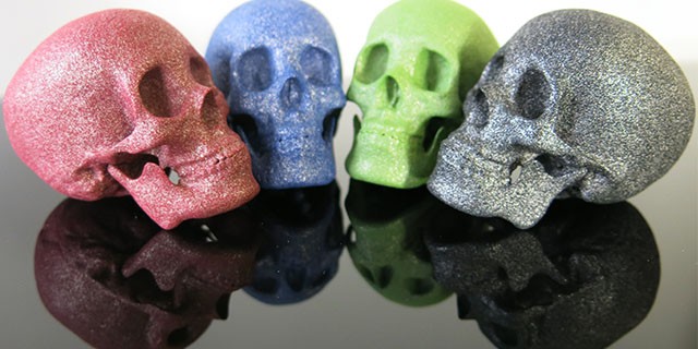 3D printed skulls in polished and colored Alumide