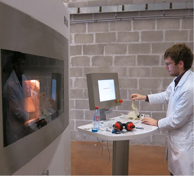 A young engineer working on a SLS 3D Printer