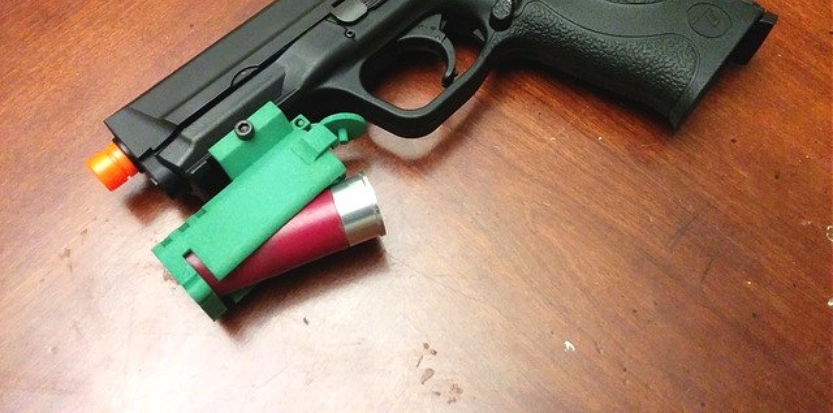 /media/picture/thumb/2015/11/30/Kvxs/full-length-green-version-mounted-on-pistol-with-shell-insertio_size_833x413..jpg